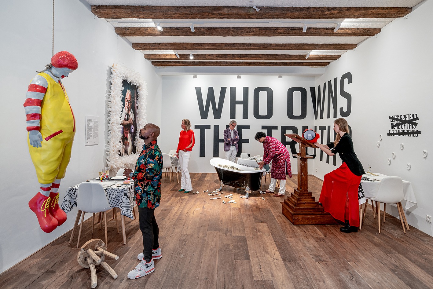 Visitors to Amsterdam's new activist art exhibition, 'Who Owns the Truth?'